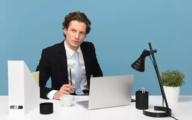 Tutor working at a tidy desk